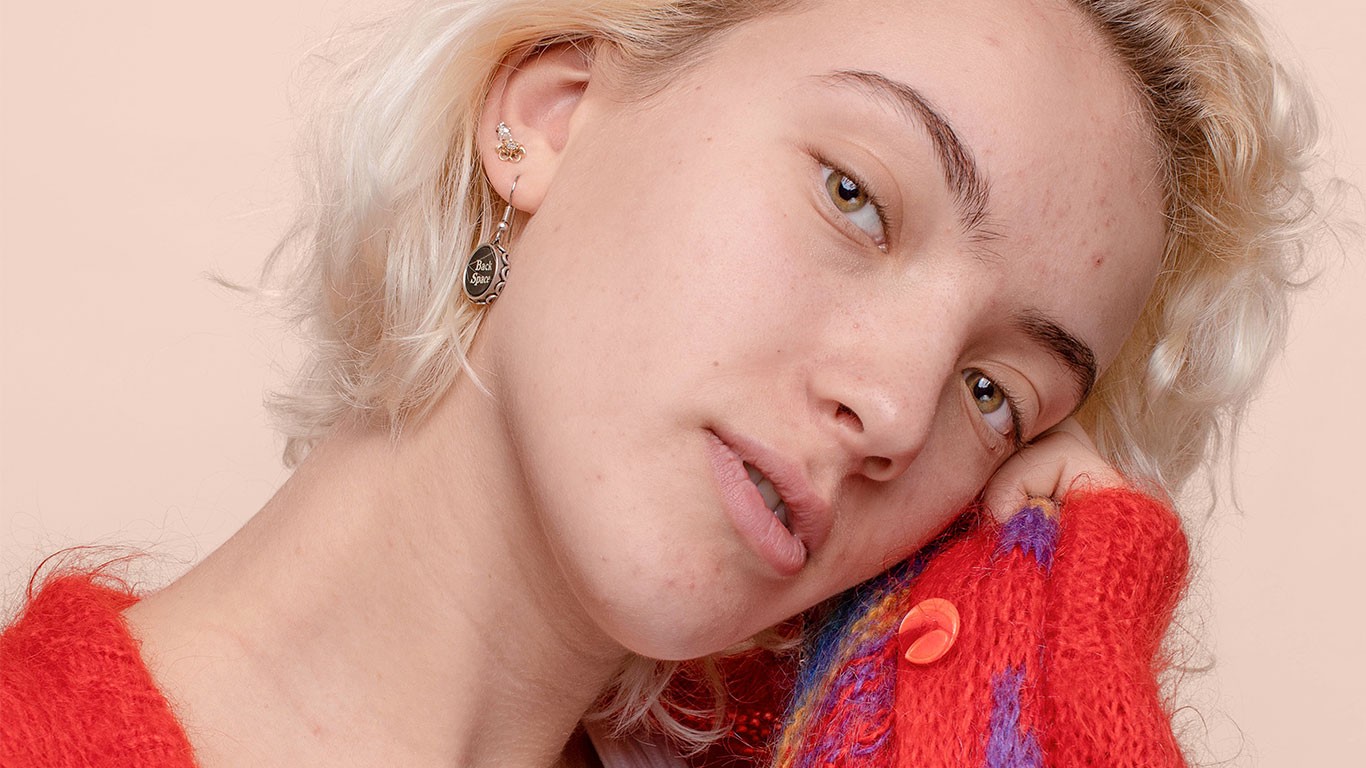 Woman resting her head on hand