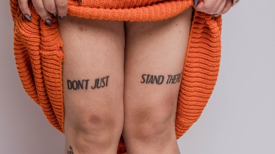 Don't just stand there tattoo on legs