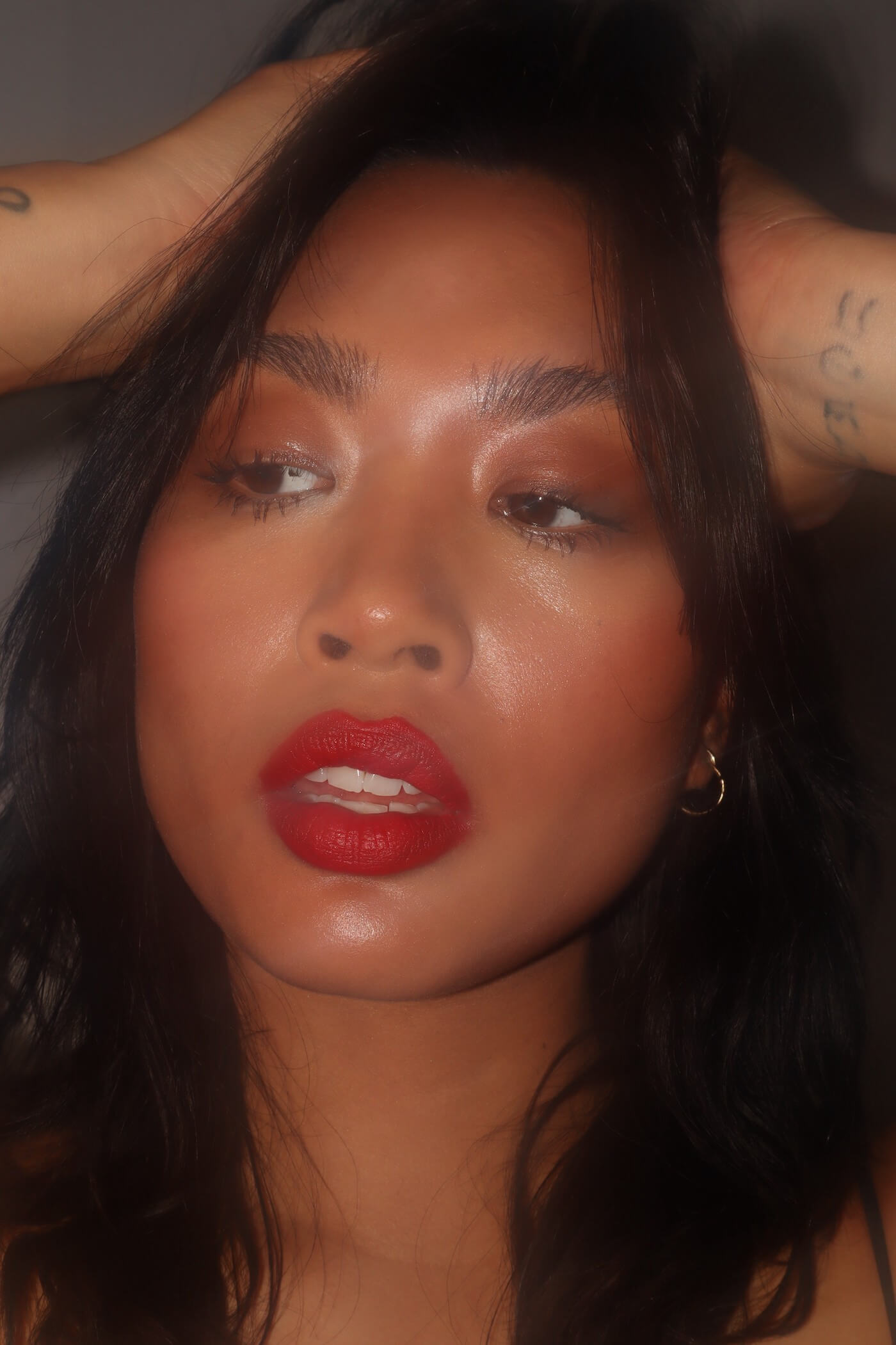 Woman with hands on her head