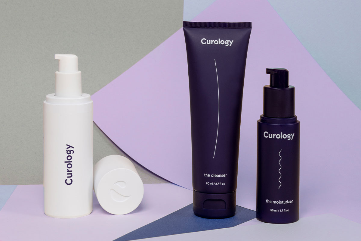 The Curology set with a piece of lilac construction paper 