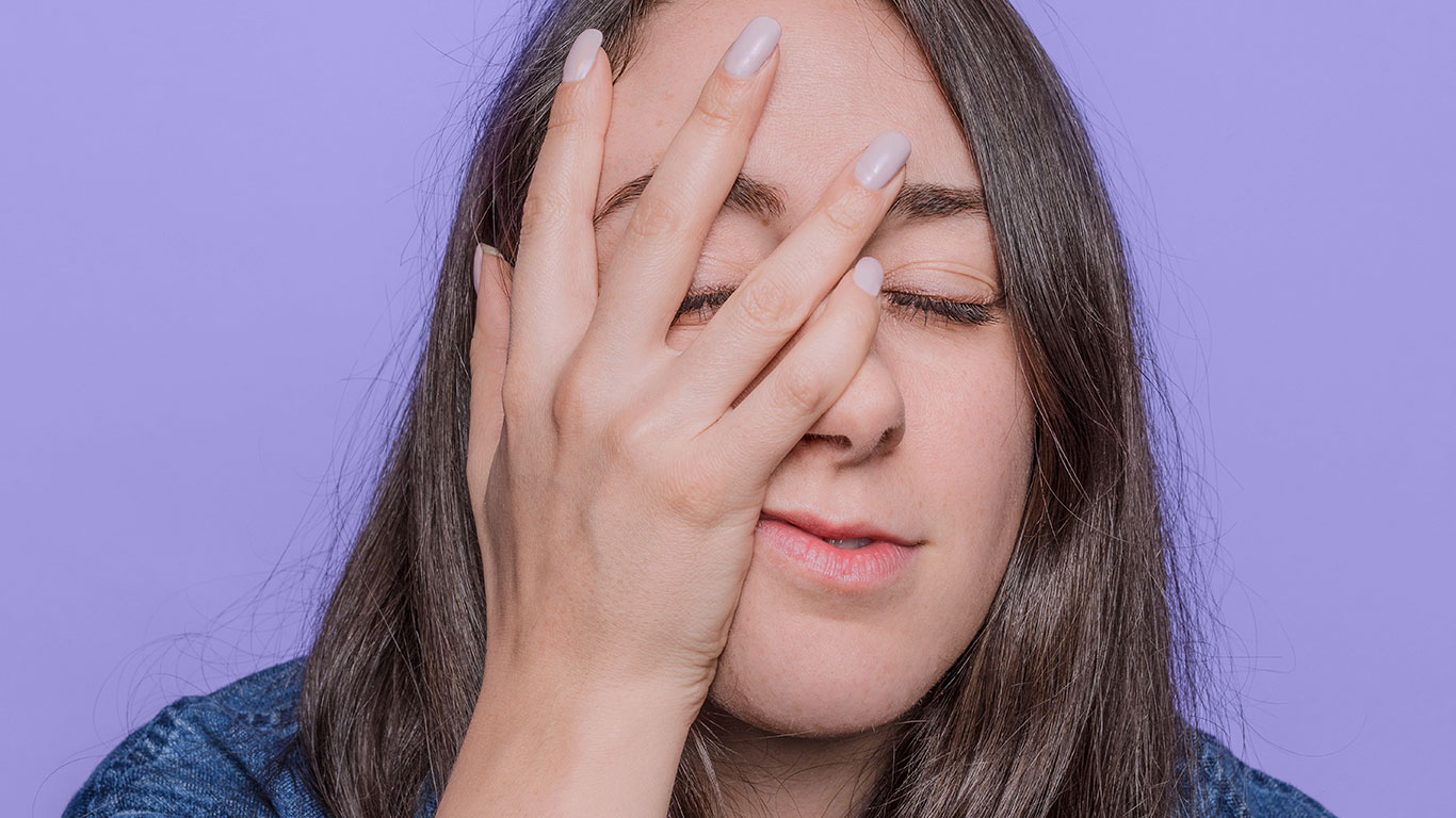 Closeup of Woman touching her face