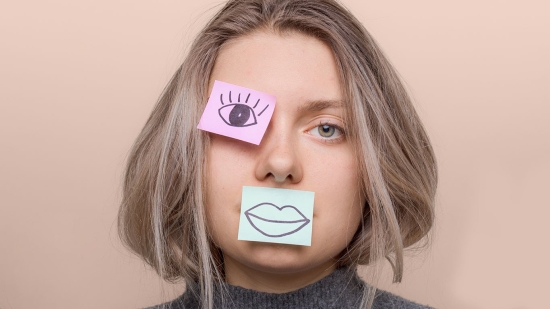 Woman with sticky notes on her face