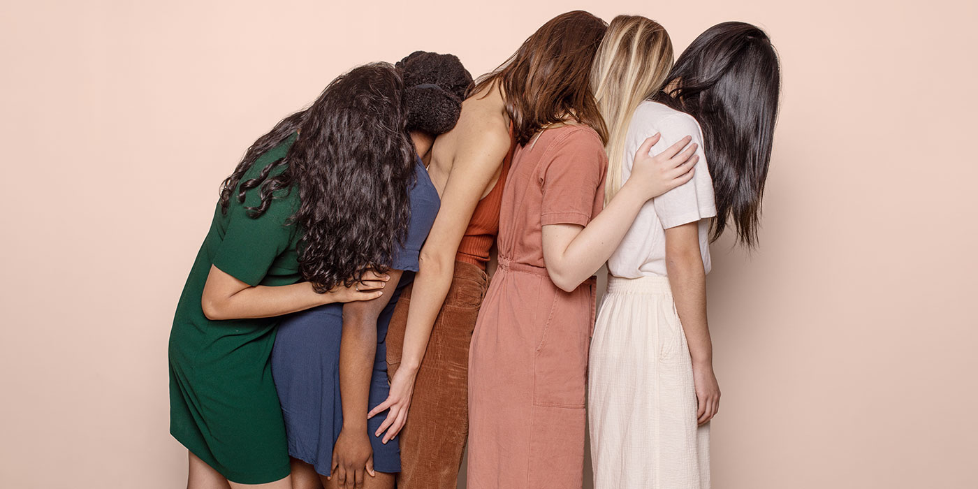 Woman standing next to eachother