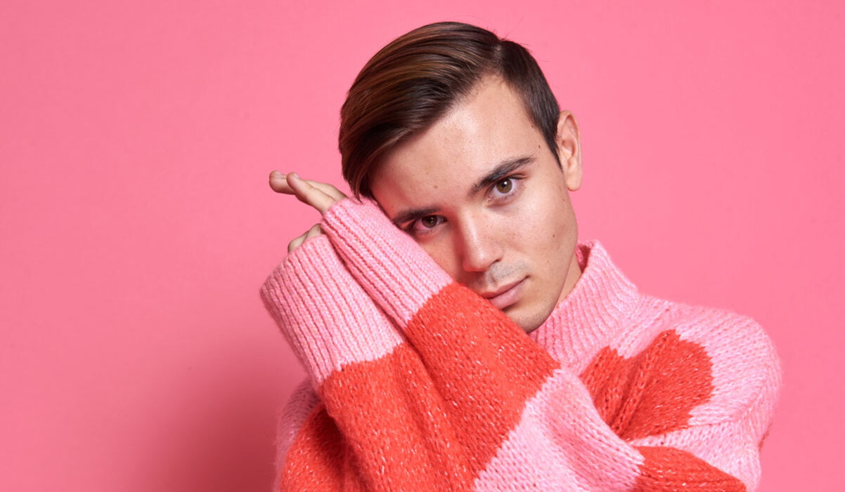 man with sweater rosacea flareup