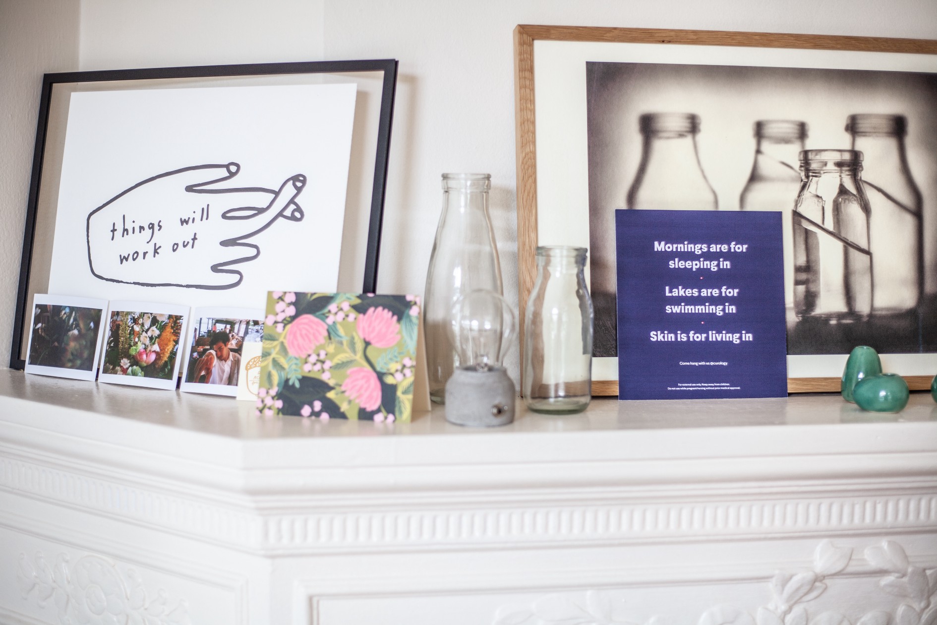 Image of shelf in home with images, bottles, and "mornings are for sleeping in" 