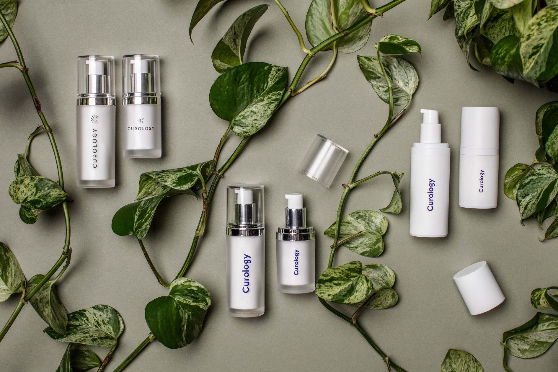 Curology bottles next to plants