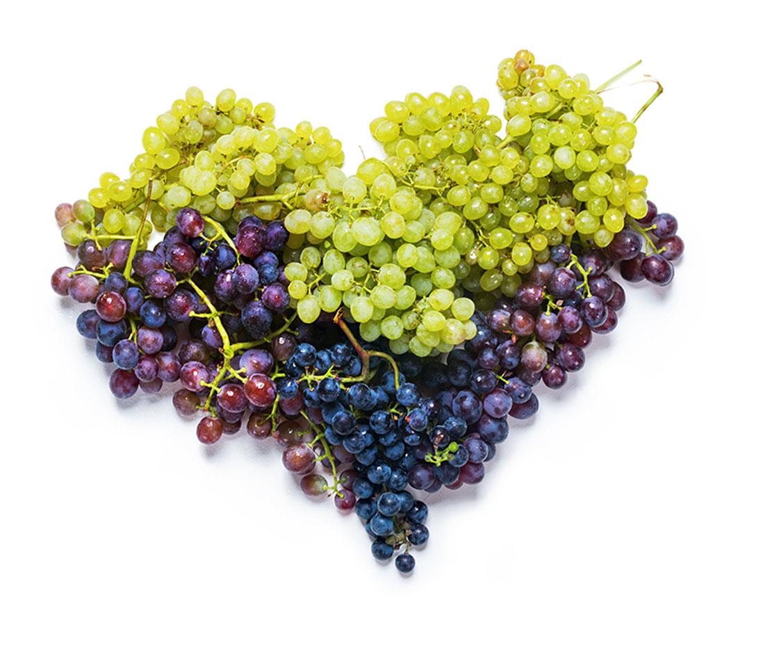 Red and green grapes in the shape of a heart