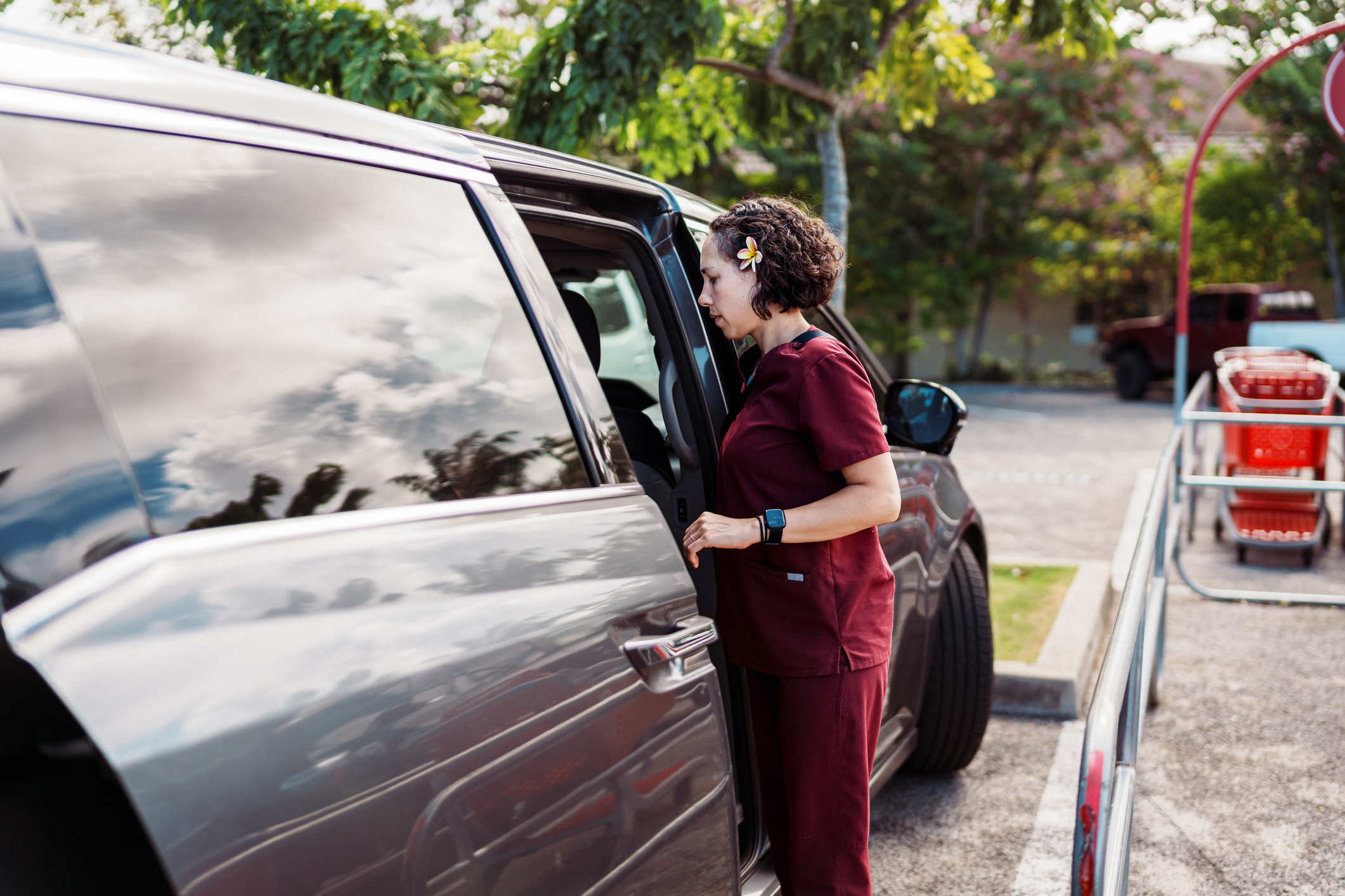 Woman getting into car