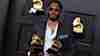 Kaytranada with his two GRAMMY awards for best dance recording and dance electronic album in 2021 for his album Bubba.