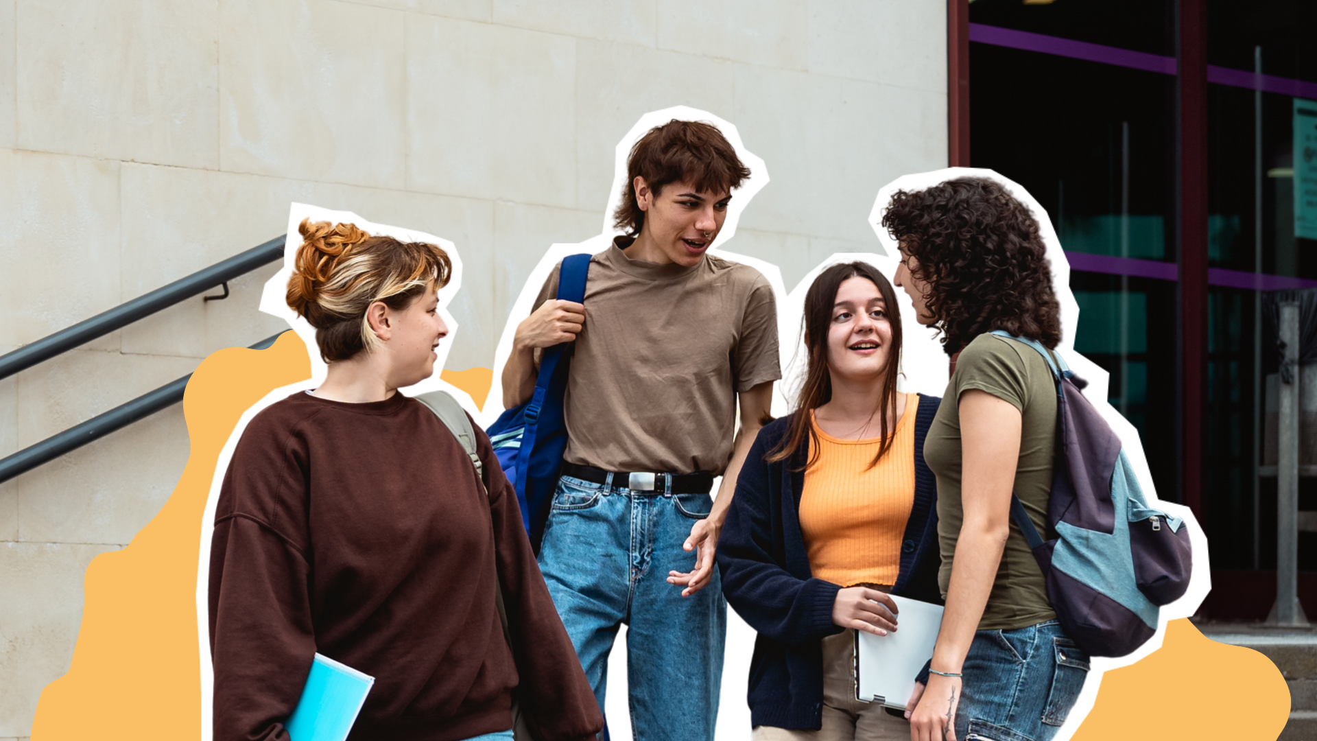 A group of young people standing together talking on some stairs outside a building.