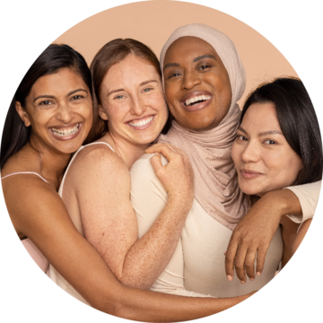 Four Women Hugging and Smiling