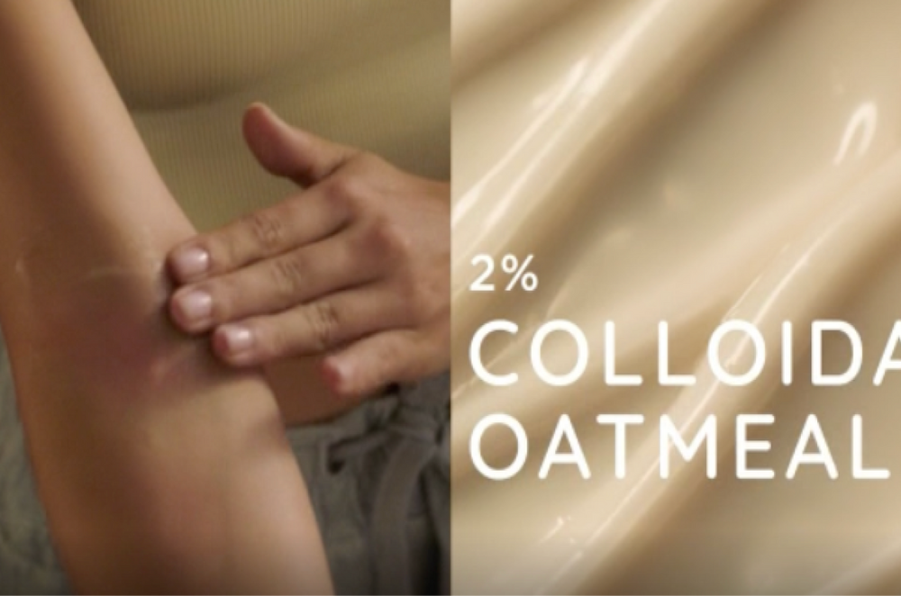 Person applying cream to arm and a labeled 2% Colloidal Oatmeal properties for skin care