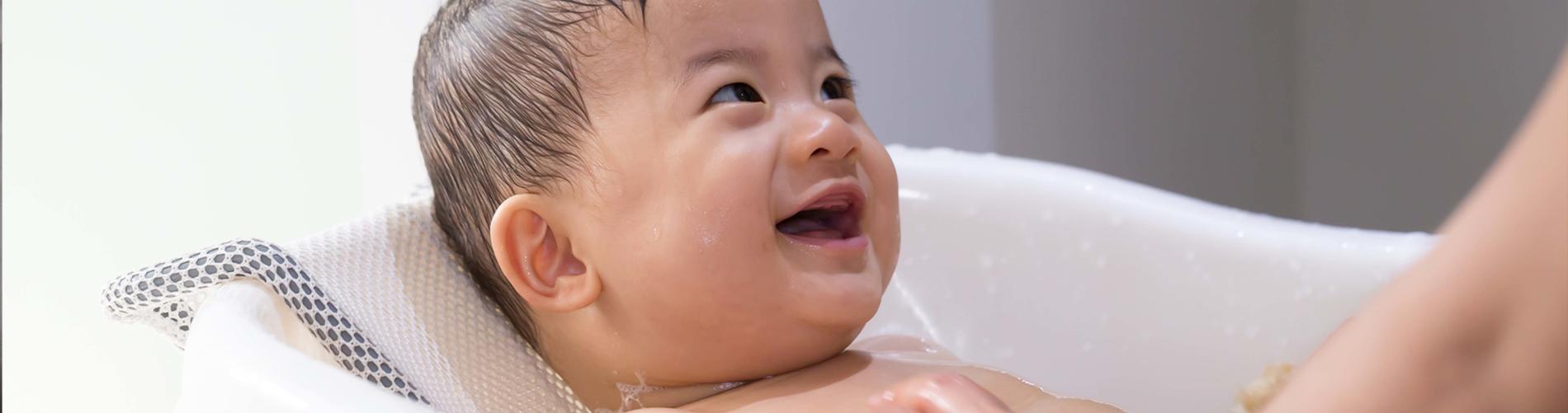 Baby laughing in bath