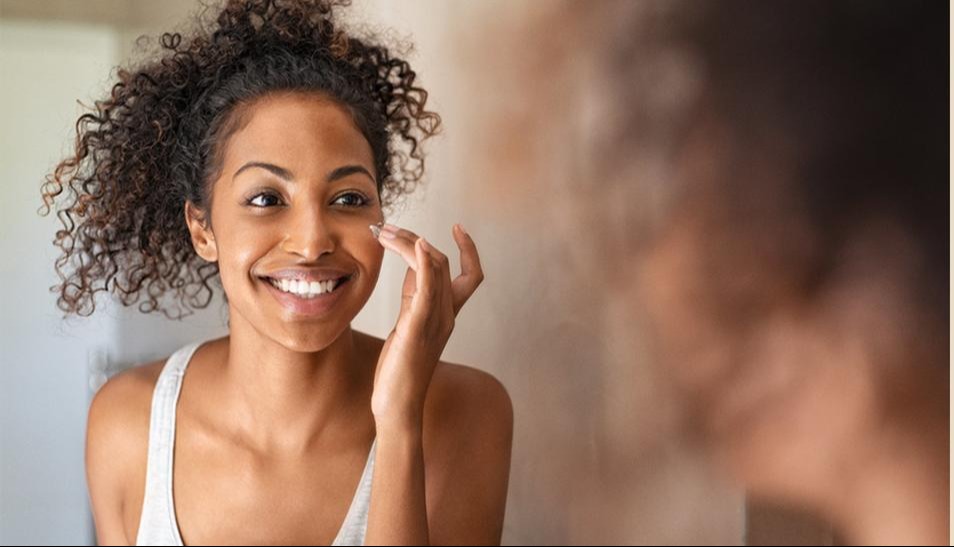 Woman touching face with fingertips