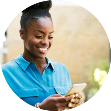 Woman Looking at Phone and Smiling