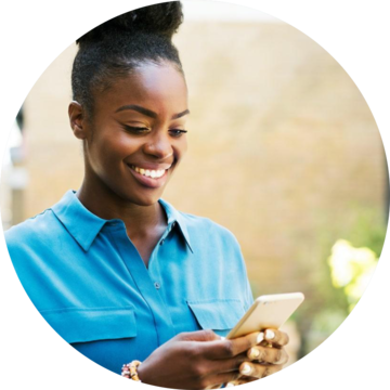 Woman Looking at Phone and Smiling
