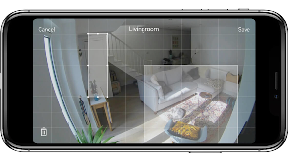 Smartphone screen showing view from Hive Indoor Camera with areas of a living room highlighted on a grid pattern