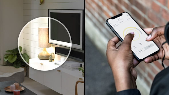 Composite image with image on the left showing living room with TV, white unit and table lamp with a bright circle superimposed over the table lamp, and the image of the right showing a close-up of a woman's hands holding a smartphone and using the Hive app