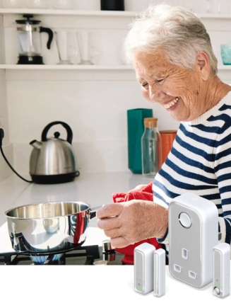 An older woman laughing in a bright white kitchen while holding a saucepan over a gas hob, a shelf in the background shows blue glasses and white mugs, and in the bottom right corner there are Hive smart devices superimposed over the image