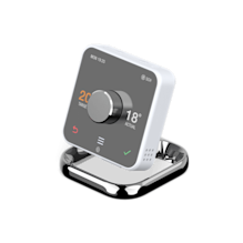 Side angle view of Hive Thermostat, sitting in a Hive Thermostat Stand, on a light grey background