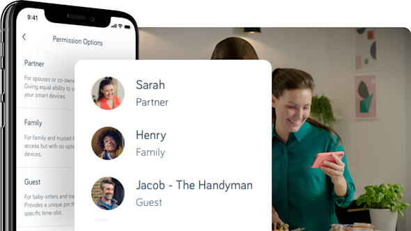 Side angle of smartphone showing Hive app with a pop-out screen in the middle of the image showing a list of people, with a couple in the background looking at a smartphone