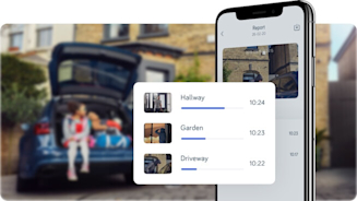Car parked outside brown brick house with smartphone and smartphone screen superimposed over image showing Hive security system app