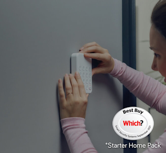 Image of a woman installing Hive Smart Home Security System Keypad on her grey wall