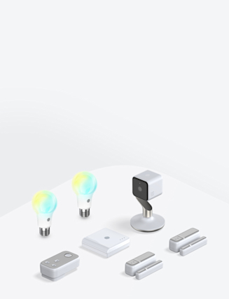 Composite image of Hive smart devices, including a Hive Thermostat, Hive smart light bulbs, Hive Plug, Hive Motion Sensor and Hive Hub, on a grey background