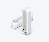 Side angle view of two Hive Motion Sensors, one standing vertical and one lying horizontal, on a white background