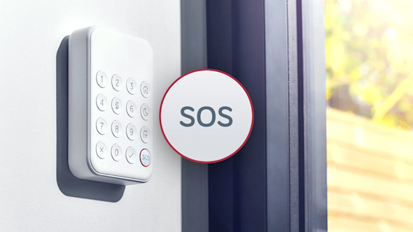 Close-up of Hive Keypad attached to a wall and next to a black-framed window, with an SOS icon superimposed over the middle of the image