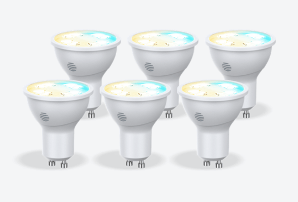 Composite image of six Hive GU10 Smart Light Bulbs, in cool to warm colours, on a light grey background