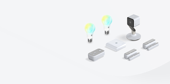 Composite image of Hive smart devices, including a Hive Thermostat, Hive smart light bulbs, Hive Plug, Hive Motion Sensor and Hive Hub, on a grey background