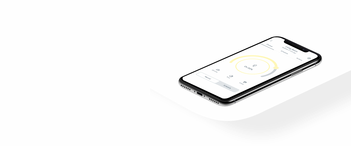 Smartphone lying down showing smart light bulb controls on the Hive app, on a white background