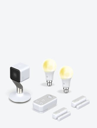 Composite image of Hive smart devices, including Hive View Indoor Camera, Hive smart light bulbs, Hive Plug and Hive Window / Door Sensors, on a light grey background
