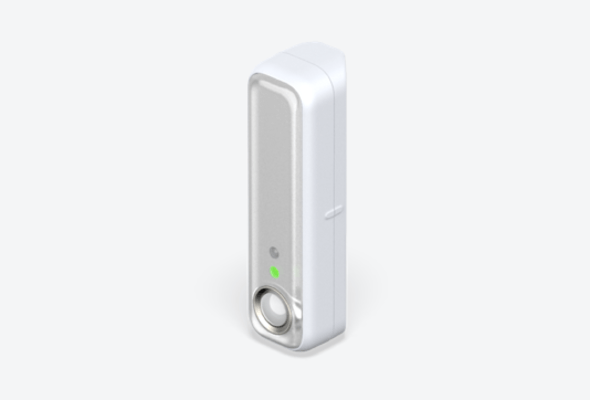 Side angle view of Hive Motion Sensor on a light grey background