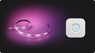 Composite image of Philips Hue Lightstrip, showing a purple light, with a Philips Hue Bridge to the right hand side, on a dark background