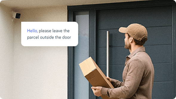 Delivery man with a parcel at the front door of a house and Hive Outdoor Camera