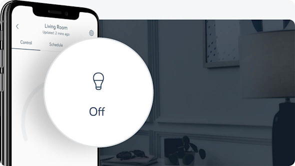 Side angle of smartphone showing the Hive app with a pop-out icon on the left of the image showing the Hive bulb on/off set-up, with table lamp in a dark hallway in the background image