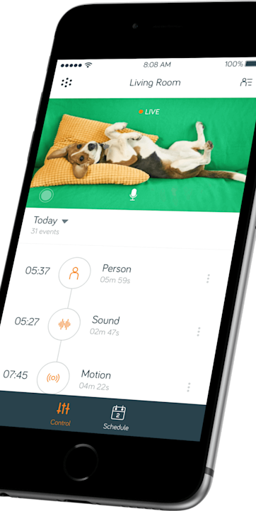 Side angle view of a smartphone showing Hive security controls in the Hive app on the screen