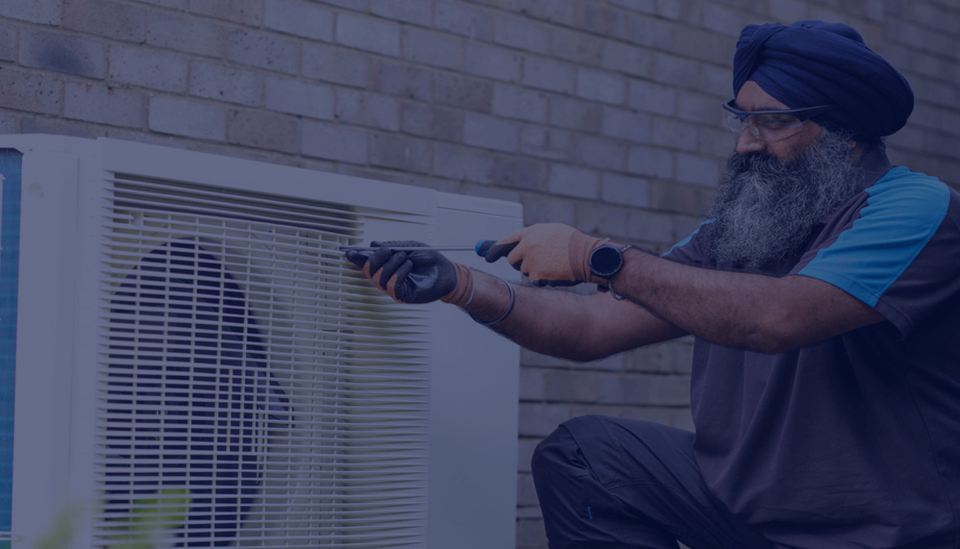 British Gas engineer installing an air source heat pump
