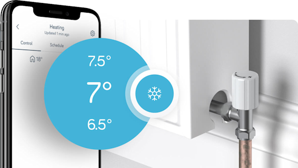 Hive app display is behind temperature overlay in text stating: "7 degrees" to indicate frost protection being activated by the Mini Thermostat to stop pipes from freezing.Radiator is on the right of image.