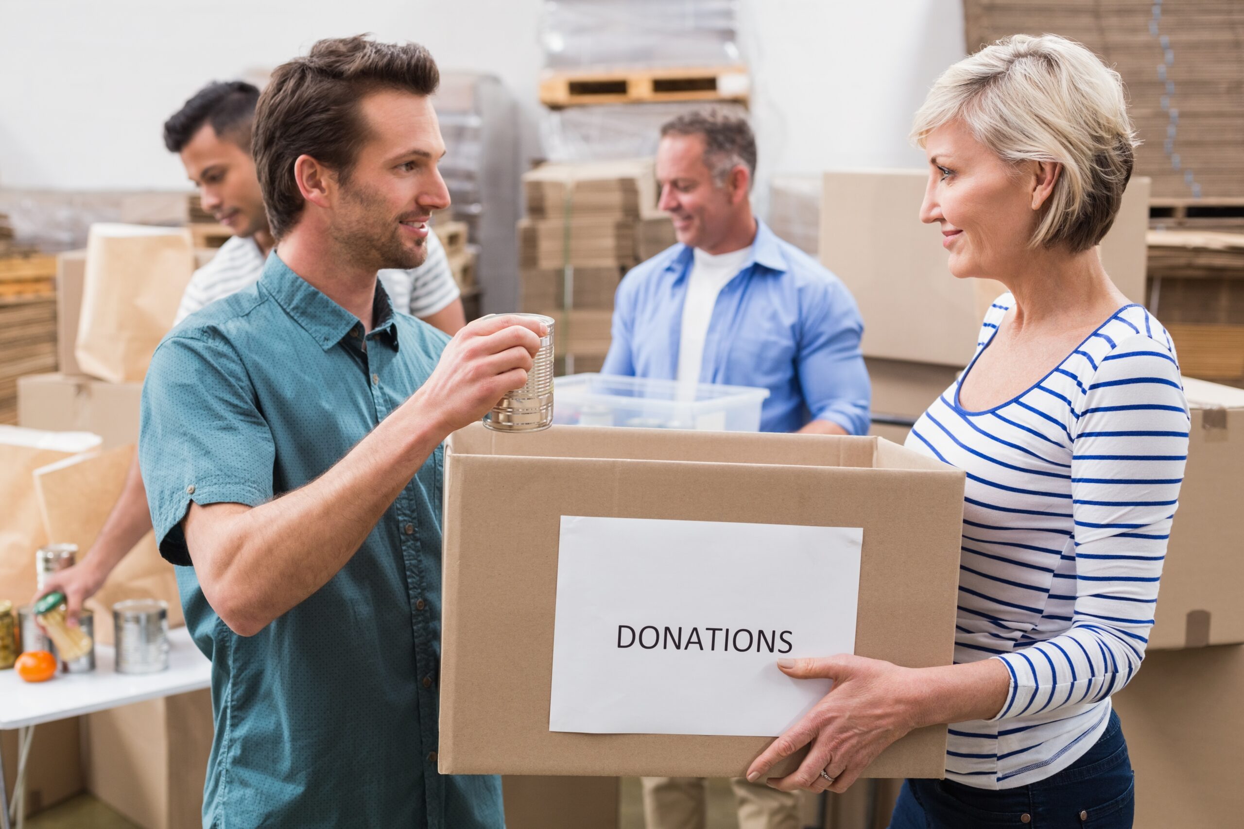 Group of people collecting and organizing donation boxes