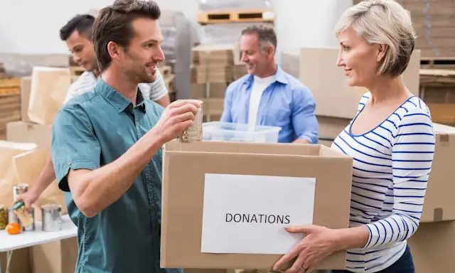 Group of people collecting and organizing donation boxes