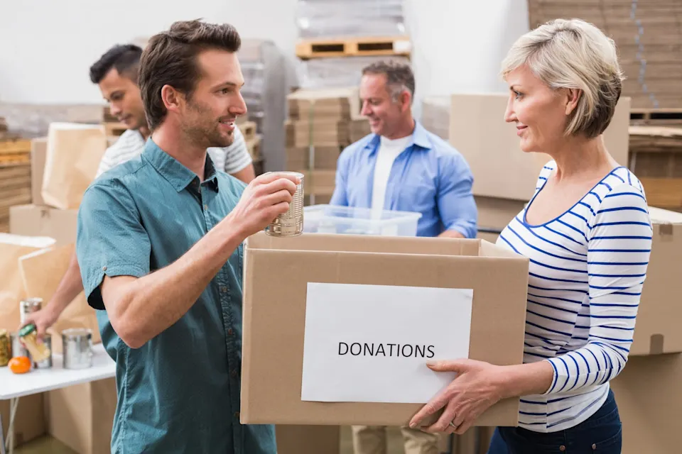 Group of people collecting and organizing donation boxes