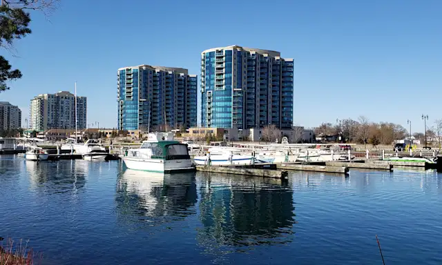 Marina with boats and tall buildings in Barrie, Ontario