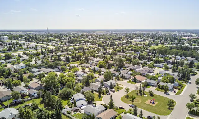 Aerial view of residential neighbourhoods in Grande Prairie on a sunny day.