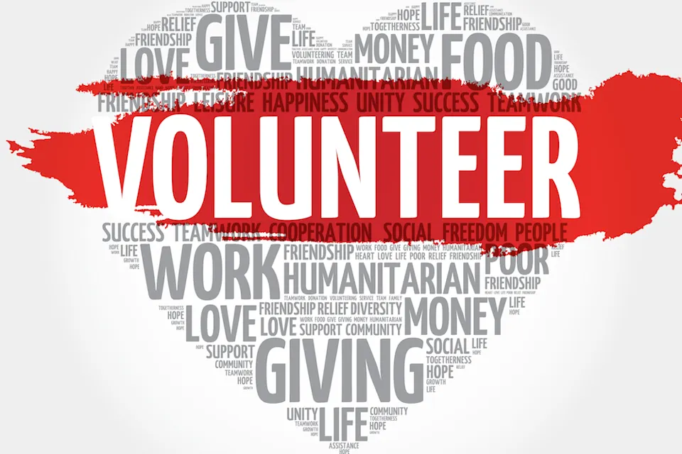 Word cloud in the shape of a heart with 'VOLUNTEER' prominently in the centre.