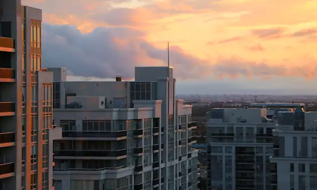 Modern high-rise buildings in Vaughan, Ontario, at sunset.