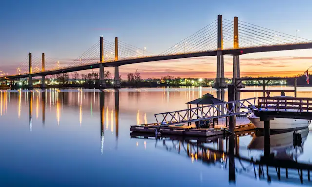 Bridge over calm water at sunset in Langley, British Columbia