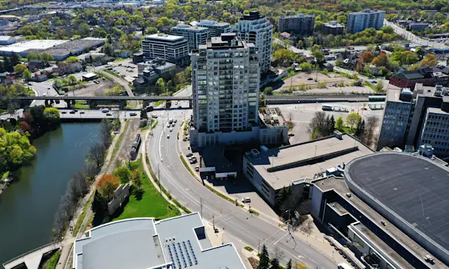Aerial view of downtown Guelph, Ontario, showing buildings, roads, and the river.